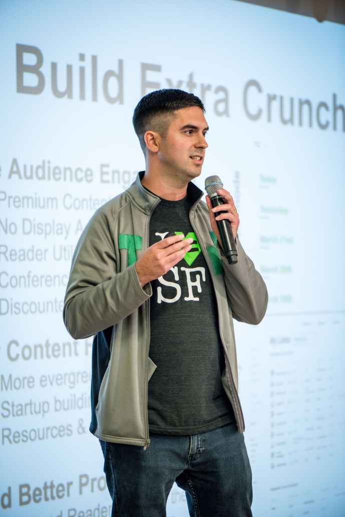 Image of Sam Singer on stage at BigWP SF discussing Extra Crunch, TechCrunch's paywall built on WordPress