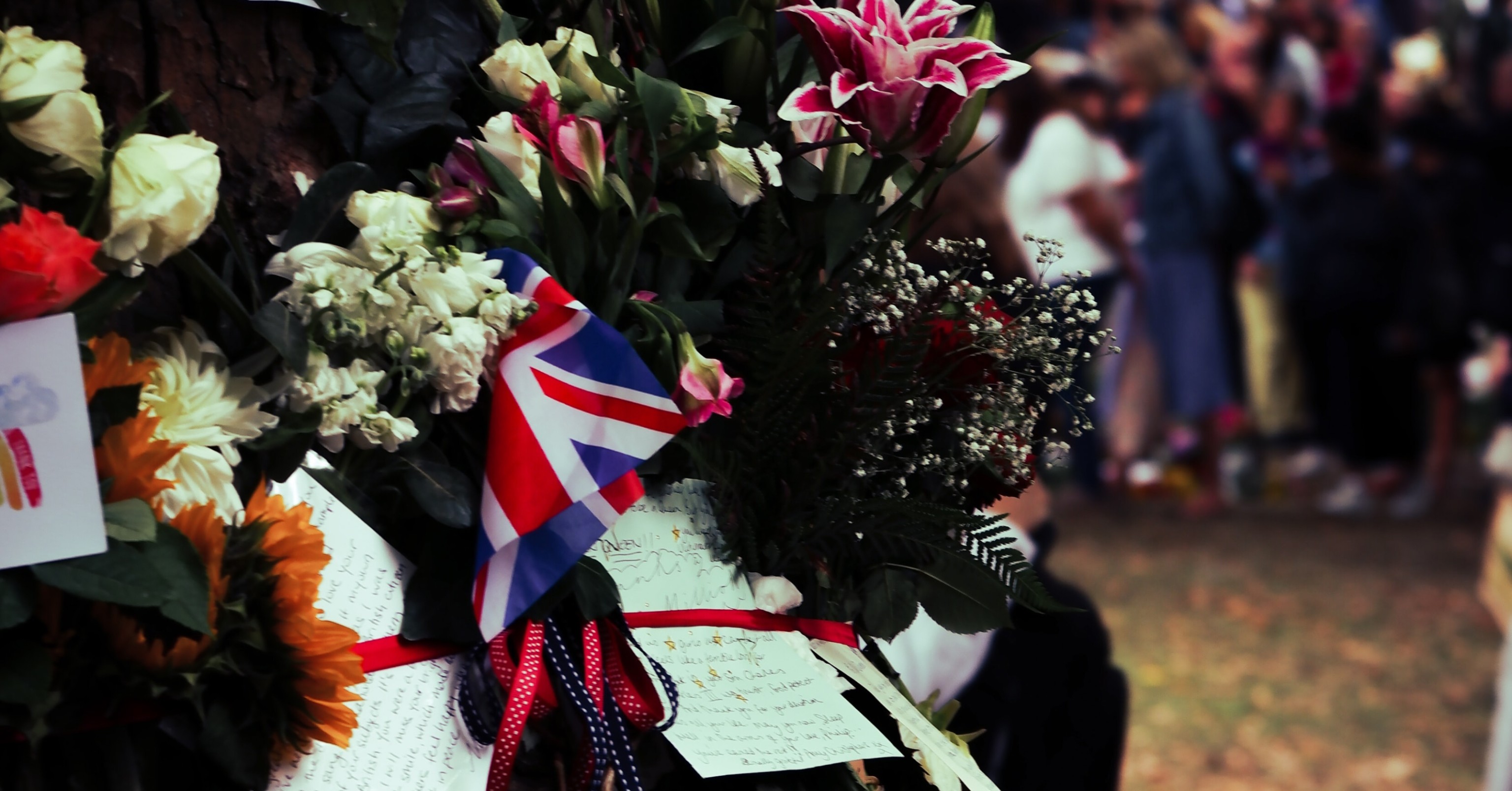 Flowers, notes, and a UK flag