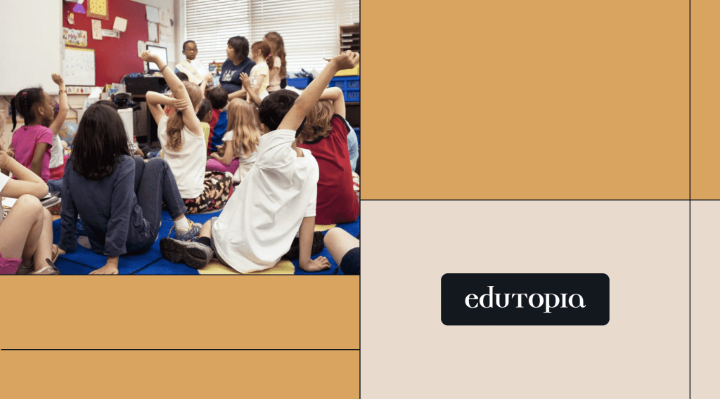 A classroom with students sitting on the floor with 3 students standing towards the front while a teacher reads a book