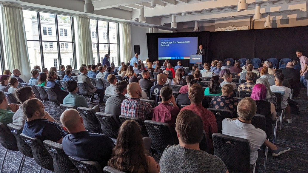 Group of people watching a presentation