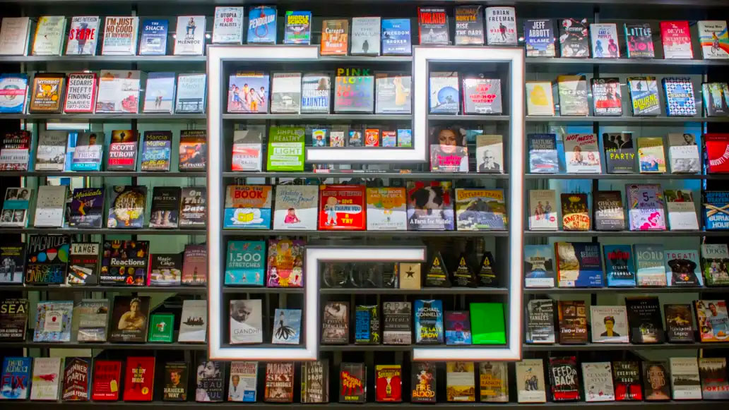 A shelf of books with the Hachette logo